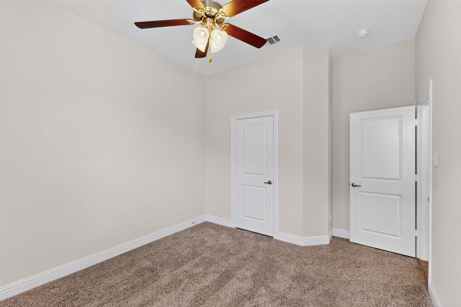 Unfurnished bedroom featuring carpet floors and ceiling fan | Image 30