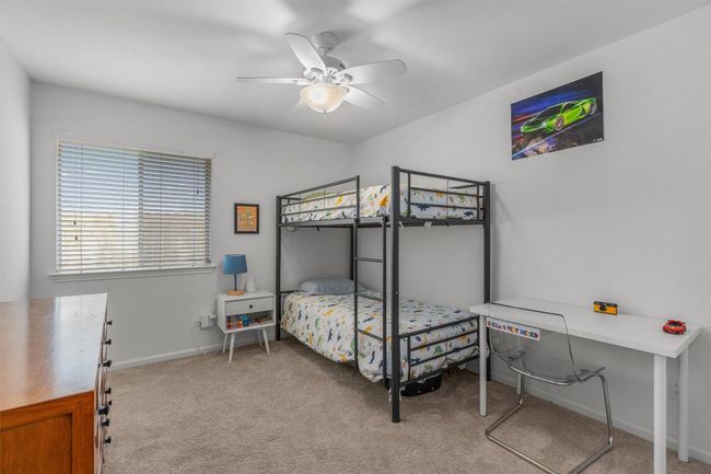 Bedroom with carpet flooring and ceiling fan | Image 22