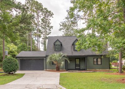 View of front of property with a front lawn and a garage | Image 1