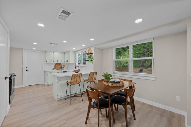 Dining room with baseboards, light wood-style flooring, and recessed lighting | Image 6