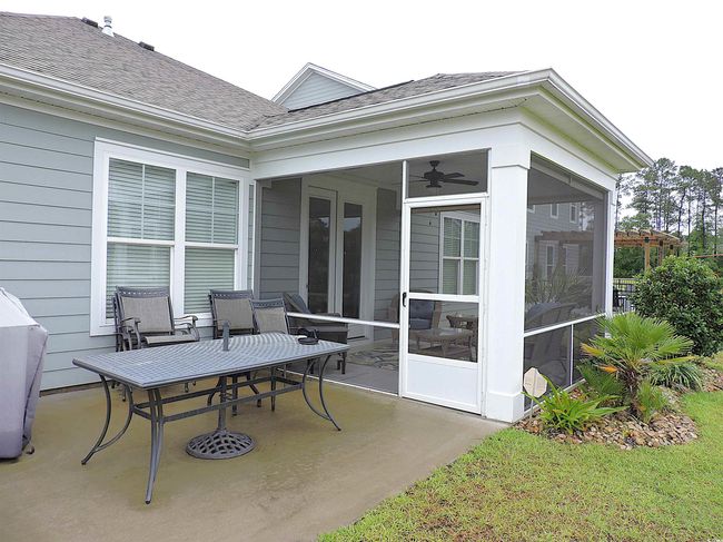 View of patio / terrace featuring a sunroom | Image 16