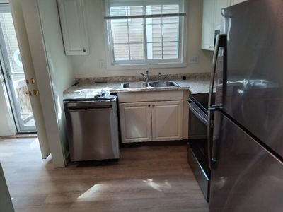 Kitchen with new floor all new painting and all new appliances | Image 3