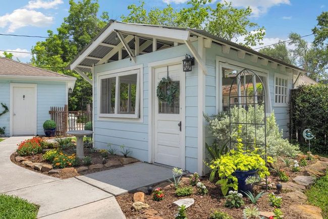 Welcome to your garden oasis! The 400sqft garden shed provides a private place to relax or entertain, while adding some unexpected character to the yard. Notice the reclaimed windows and door. | Image 21