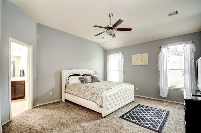 Tucked away at the back of the home is the stunning owner's suite. | Image 17