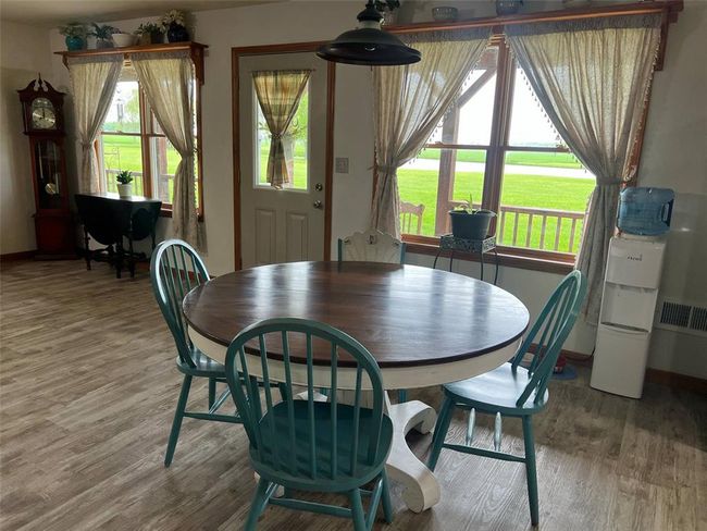 Dining area with light wood-type flooring and baseboards | Image 4