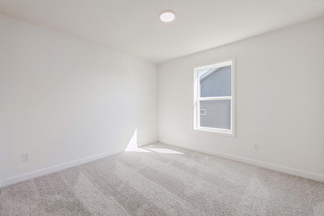 (*Photo of actual home) One of the upper level secondary bedrooms | Image 13