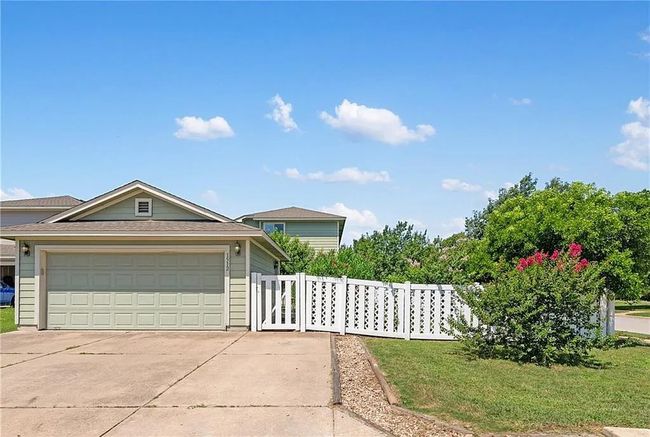 View of front of home featuring concrete driveway and a garage | Image 20