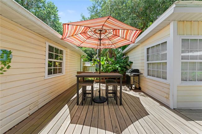 Patio Deck between the large garage and the cottage | Image 8