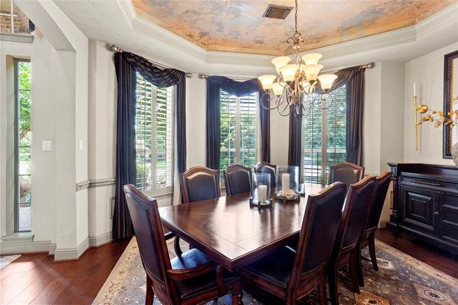 Formal dining is large enough for another 8 person table, hutch and china cabinet with plenty of room left.This will wow you off the entry with custom painted ceiling, rope accent lighting, chair rail and custom drapery. | Image 14
