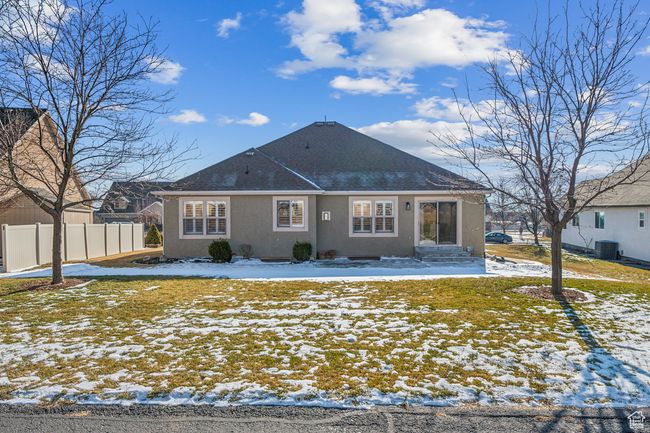 Snow covered house featuring central AC | Image 42