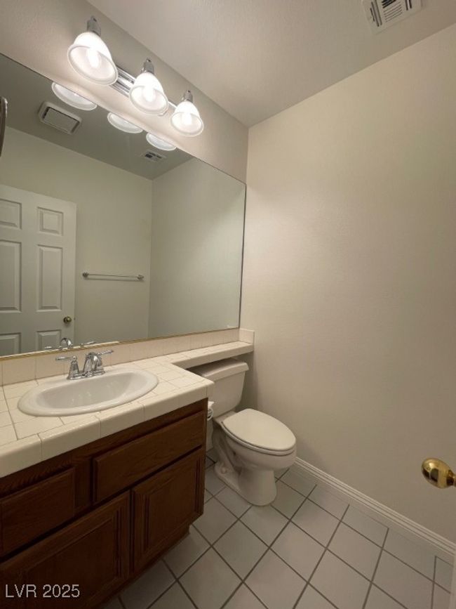 Half bath featuring tile patterned flooring and vanity | Image 15