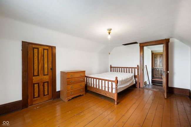 bedroom featuring vaulted ceiling and light wood-style floors | Image 12