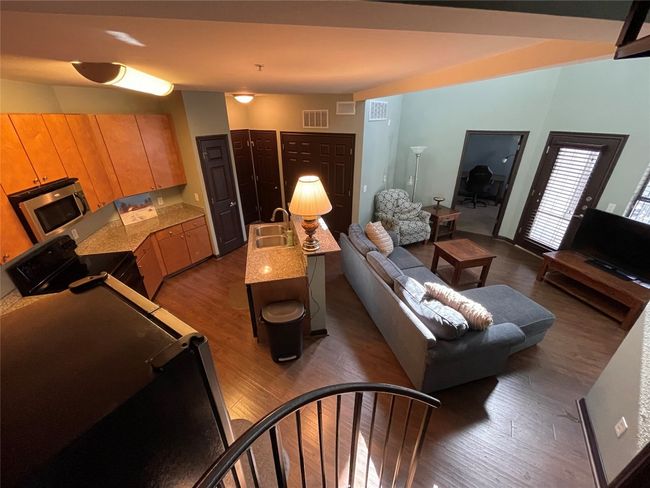 Living area featuring dark wood-style floors | Image 25