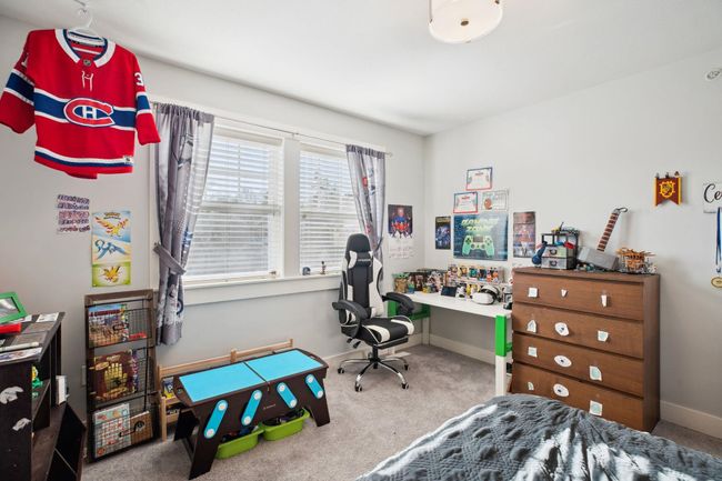 Carpeted bedroom with baseboards | Image 25