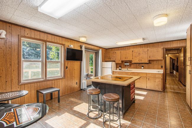 Bonus Room over garage with kitchenette and french doors to a private deck. | Image 21