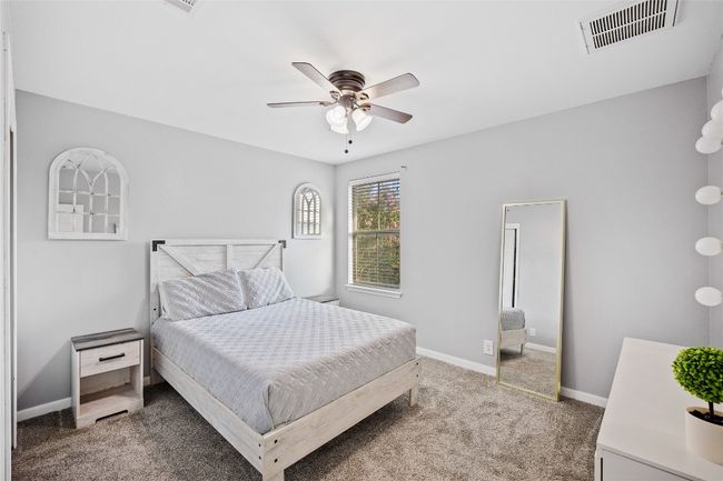 Bedroom featuring carpet floors and ceiling fan | Image 16