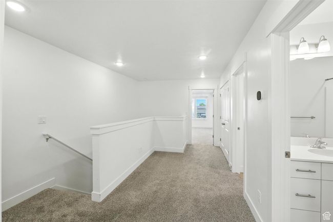 Corridor with an upstairs landing, carpet floors, and recessed lighting | Image 8