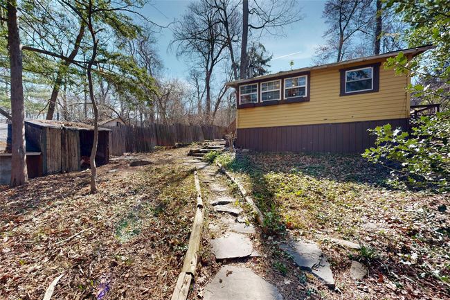 View of property exterior featuring fence | Image 25