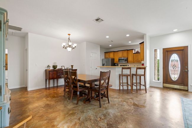 Wide open flow from kitchen to dining to living—because Hill Country living is all about keeping it connected and comfortable. | Image 17
