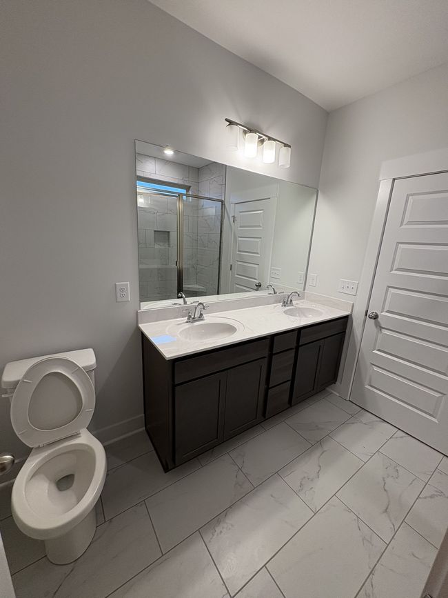 STOCK PHOTO. SELECTIONS WILL VARY IN ACTUAL HOUSE. Primary bathroom features double vanity. | Image 19