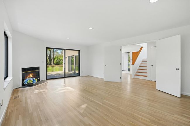 Double doors provide a gracious entry to this large and inviting family room. | Image 5