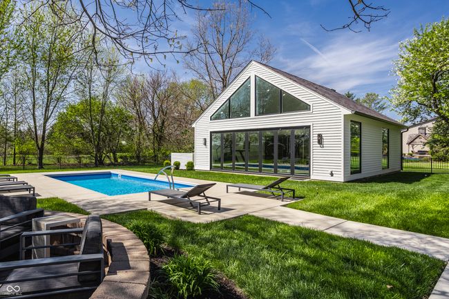 view of Brand new casita with fence private yard, an outbuilding, a fenced in pool, a patio area, and a lawn | Image 56