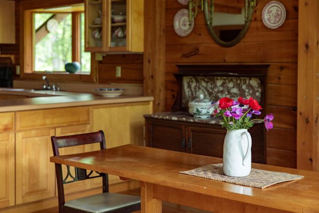 Dining area featuring wood walls | Image 6