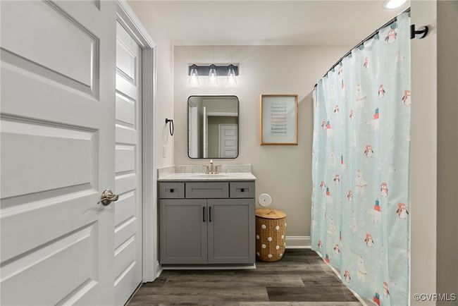 Bathroom with hardwood / wood-style floors and vanity | Image 31