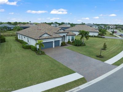 Ranch-style house featuring a garage and a front lawn | Image 3