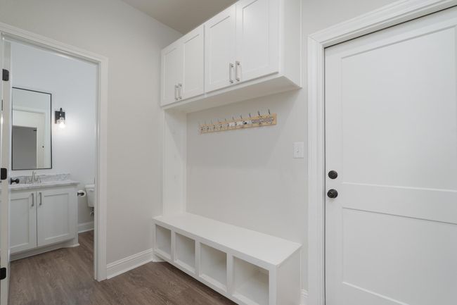 Mudroom featuring dark wood-style flooring and baseboards | Image 31
