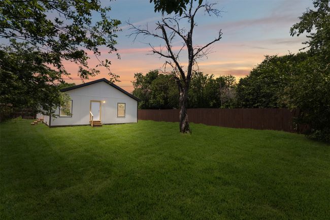 Yard at dusk featuring entry steps | Image 28