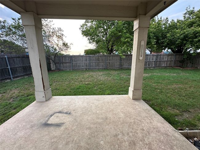 Fenced backyard featuring a patio | Image 39