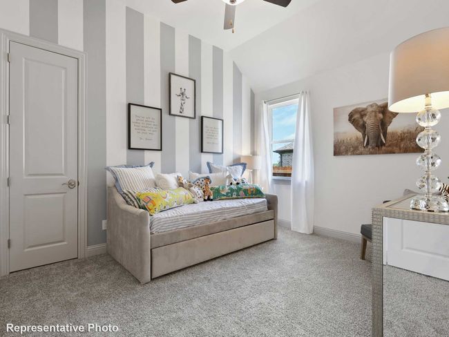 Bedroom featuring baseboards, a ceiling fan, vaulted ceiling, and carpet | Image 15