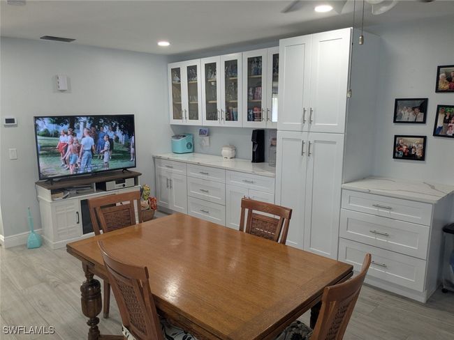 Dining room with a ceiling fan, light wood-style flooring, baseboards, visible vents, and recessed lighting | Image 20