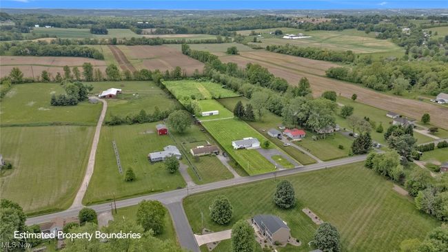 Aerial view of property's location featuring rural landscape and rows of crops | Image 37
