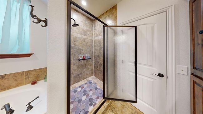 Bathroom with a shower stall and a garden tub | Image 38