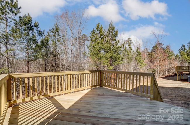 Deck at backyard with wooded view | Image 31