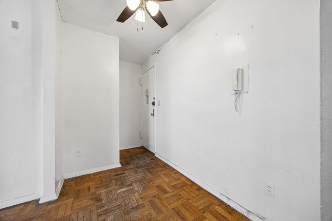Spare room featuring ceiling fan and baseboards | Image 8