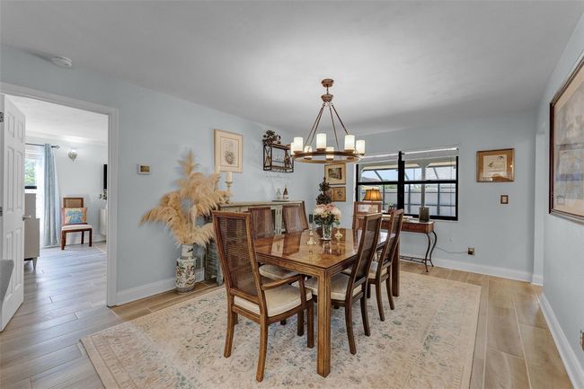 Dining Room large enough to accommodate your guests and family with the perfect overlook of the pool | Image 7