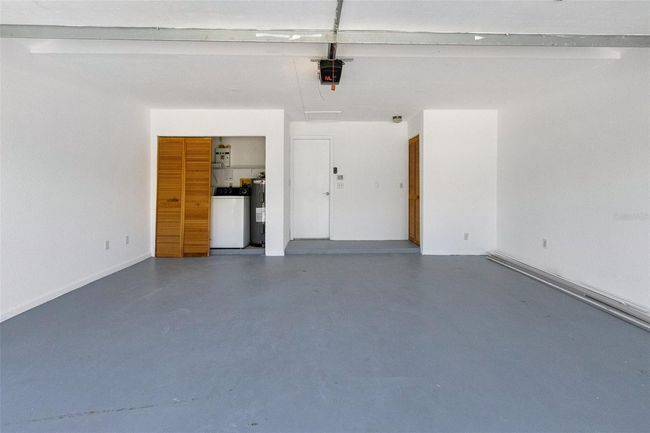Freshly painted 2-car garage with plenty of space for storage, tools, or hobbies | Image 14