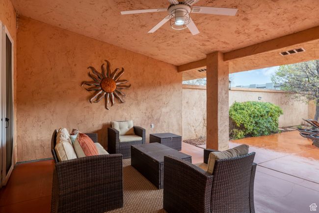 View of patio / terrace with a ceiling fan, visible vents, and fence | Image 34