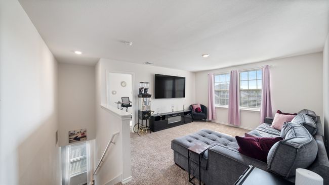 Carpeted living area with recessed lighting | Image 22