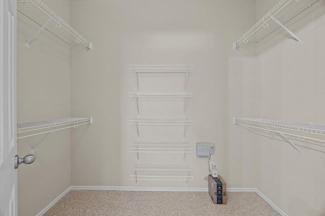Spacious closet featuring carpet floors | Image 21