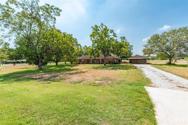 Home and garage currently on the property. | Image 24
