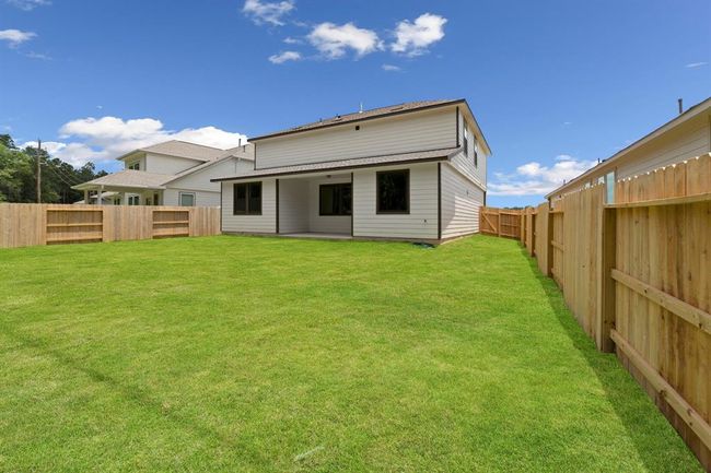 This backyard is perfect for family gatherings, social events, or simply unwinding in the fresh air. | Image 22