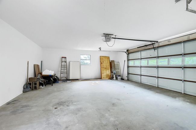 Garage featuring a garage door opener | Image 20