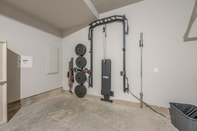 2 car garage with door opener and retractable workout weight station that can convey to the new buyer - View | Image 4
