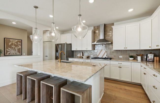 Bright kitchen with ample cabinet space *Photos of furnished model. Not actual home. Representative of floor plan. Some options and features may vary | Image 11