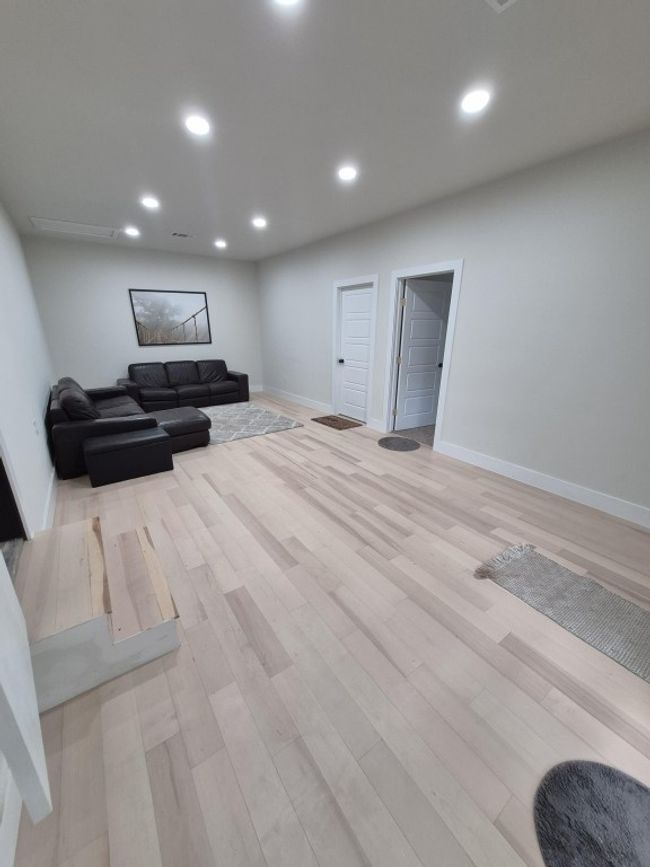 Living area featuring light wood-type flooring and recessed lighting | Image 6