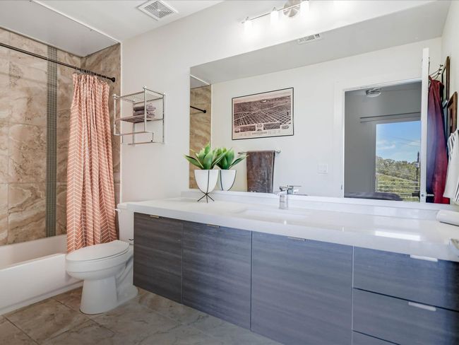 Full bathroom with vanity and shower / bath combo with shower curtain | Image 17